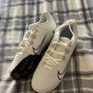 White and Black Pitching Softball Cleats. Never worn, D1 college sport spikes.